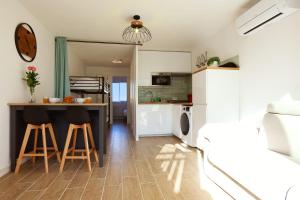 Kuchyň nebo kuchyňský kout v ubytování Appartement Fantino - Welkeys