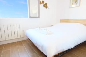 Postel nebo postele na pokoji v ubytování Appartement Fantino - Welkeys
