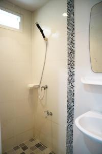 a bathroom with a shower and a sink at Happyhouse Laksi station (PK14) in Lak Si