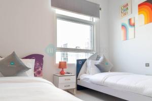 Postel nebo postele na pokoji v ubytování Grandeur 2 Bedroom Suite