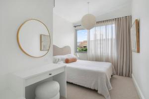 Luxury Designer Redfern House tesisinde bir odada yatak veya yataklar