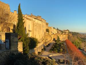 an old building with a garden in front of it at Clementine - Private Studio 50m from Centre Ville in Lauris