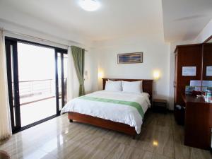 Voodi või voodid majutusasutuse Manarra Sea View Resort toas