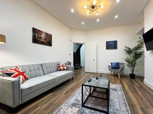 a living room with a couch and a table at Ana’s Place in Harrow on the Hill in Harrow