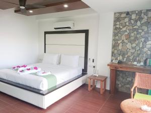 Voodi või voodid majutusasutuse Manarra Sea View Resort toas