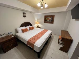 Llit o llits en una habitació de Hotel Casablanca 160