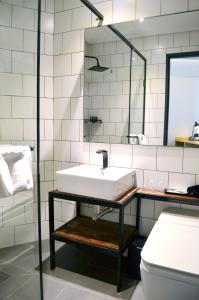 a bathroom with a sink and a toilet at Glue Hotel in Seoul