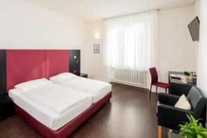 Ένα ή περισσότερα κρεβάτια σε δωμάτιο στο Hotel Rio Muralto
