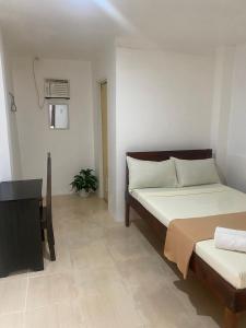 Postel nebo postele na pokoji v ubytování Bonzu Homestay