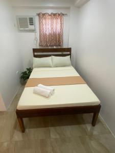 Postel nebo postele na pokoji v ubytování Bonzu Homestay