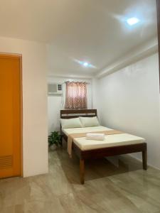 Postel nebo postele na pokoji v ubytování Bonzu Homestay