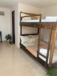 Postel nebo postele na pokoji v ubytování Bonzu Homestay