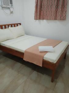 Postel nebo postele na pokoji v ubytování Bonzu Homestay