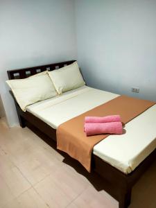 Postel nebo postele na pokoji v ubytování Bonzu Homestay