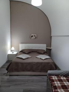 A bed or beds in a room at Casa del Duomo Modica