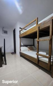Postel nebo postele na pokoji v ubytování Bonzu Homestay