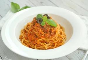 a white bowl of spaghetti with a plant on top at Natural bungalows in Kampong Cham +16 photos