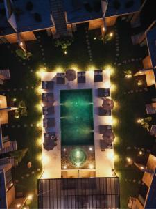 an overhead view of a garden at night with lights at Bora Boutique - Adults Only in Puerto Escondido