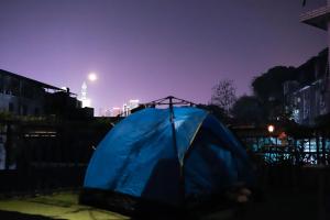 a blue tent in the middle of a city at night at Changsha Fuxiangyuan International Hostel in Changsha