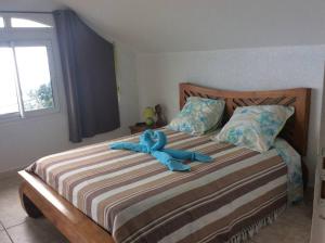 Postel nebo postele na pokoji v ubytování A la belle Etoile. Appt de charme 1er ét. villa