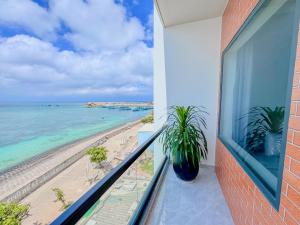 a balcony with a view of the beach at ChanKy Hotel Dao Phu Quy in Cu Lao Thu