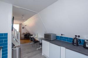 Kuchyň nebo kuchyňský kout v ubytování Chalet Fortyone