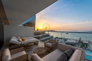 a living room with a view of the ocean at FIVE LUXE in Dubai