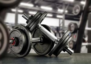a dumbbell sitting on a table in a gym at Clarion Hotel Mestari in Helsinki