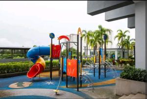 a playground with a slide in a park at HCK24 2br Aeon Bukit Indah Legoland Johor Bahru in Johor Bahru