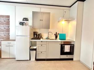 A cozinha ou cozinha compacta de Motel38
