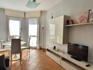 a living room with a large flat screen tv at Appartamento Betti in Rapallo