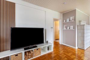 a living room with a large flat screen tv at Scandinavian in Schloß Holte-Stukenbrock