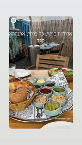 a table with a turkey and other dishes of food at Atnachta BaGilboa in Addirim