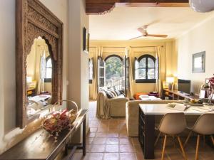 a living room with a couch and a table at Mirador de los arcos Alhambra in Granada