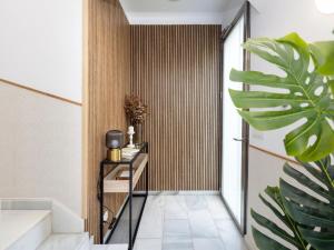 a hallway with a staircase and a plant at San Anton Boutique Terrace in Granada