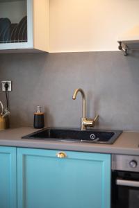 a kitchen with a sink and a counter top at VUAR SUITES in Petalidi