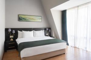 Postel nebo postele na pokoji v ubytování Sephia Hotel + 37 fotografií