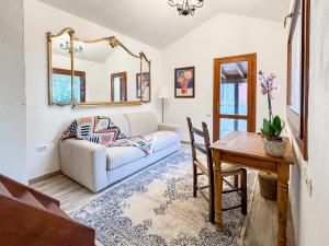 a living room with a couch and a table at Villa La Petite Etoile in Torre delle Stelle