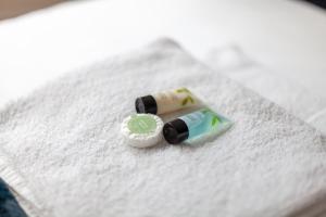 a toothbrush and a tube of toothpaste on a towel at Cannon Street Studios in London