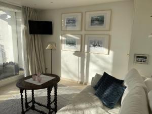 a living room with a couch and a table at Strandgut in Rostock