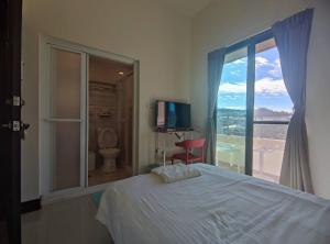 Uma cama ou camas num quarto em Dahu Yipinyuan B&B