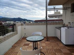 Uma varanda ou terraço em Dahu Yipinyuan B&B