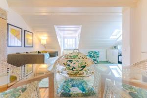 a living room with a glass table and a couch at Portas da Sé Apartments in Lisbon