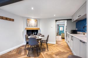 a kitchen and dining room with a table and chairs at 32 Bailgate, Lincoln in Lincolnshire