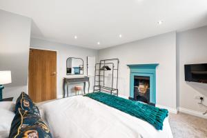 a bedroom with a large bed and a fireplace at 32 Bailgate, Lincoln in Lincolnshire