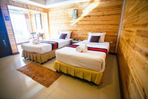 Postel nebo postele na pokoji v ubytování Maekhong Delta Boutique Hotel