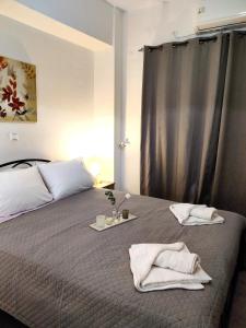 Postel nebo postele na pokoji v ubytování Bellos Corfu Center Apartment