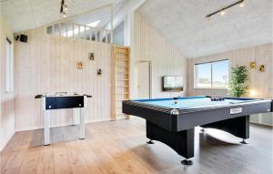 a large room with a pool table in it at Amazing Home In Bogense With Sauna in Bogense
