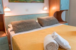Postel nebo postele na pokoji v ubytování Hotel Atlantic