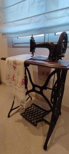 a sewing machine sitting on a table with a towel at Casa Mar, with parking and ideal for families in Sant Feliu de Guíxols